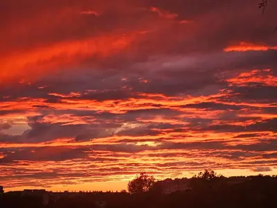a sunset with clouds in the sky at Shambala B&B in Sitges