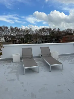 two chairs sitting on top of a roof at Apartamentos ELMA1 in Castelldefels