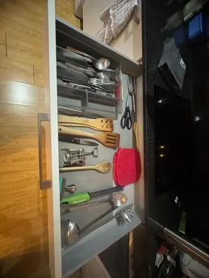 a drawer filled with lots of cooking utensils at barceloneta street apartment 1 in Barcelona
