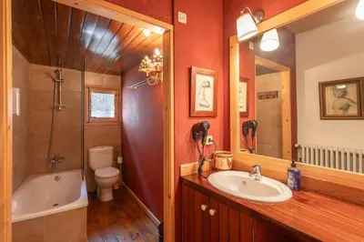 a bathroom with a sink and a tub and a toilet at Masia Brugarolas in Castelltersol