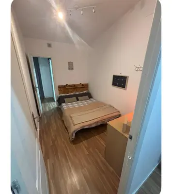 a room with two beds and a table in it at Badalona Old town in Badalona