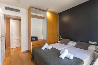 a bedroom with two beds with white pillows on them at Apartment Barcelona Rentals - 3 bedroom penthouse with large terrace in Barcelona