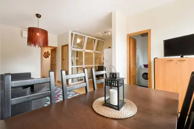 a dining room and living room with a dining table at Apartment Poble Nou in Barcelona