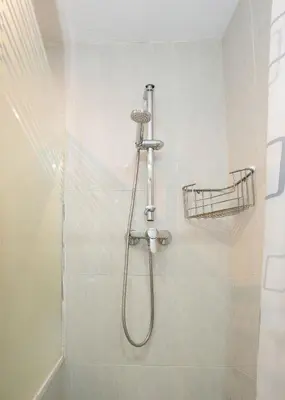 a shower with a shower head in a bathroom at Apartamento Comte Borrell in Barcelona