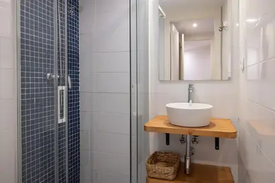 a bathroom with a sink and a shower at Stay U-nique Sant Pau in Barcelona