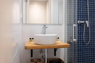 a bathroom with a sink and a shower at Stay U-nique Sant Pau in Barcelona