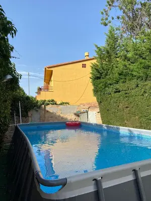 a large swimming pool sitting on top of a balcony at Cal Llanto in Torrellas de Foix
