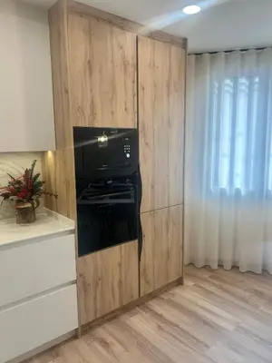a living room with a black fireplace in a wall at Villa Montjuic Apartments in Barcelona