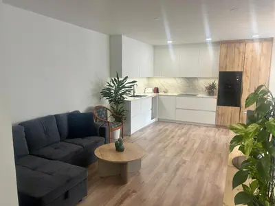 a living room with a couch and a table at Villa Montjuic Apartments in Barcelona