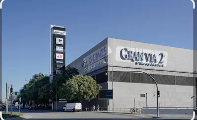 a building with a car parked in front of it at Fira Gran Via & Aeropuerto Barcelona Mi Colibrí in Hospitalet de Llobregat