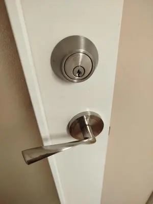 a door with a metal handle on a door at Affordable apartament & rooms in city center in Barcelona