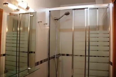 a shower with a glass door in a bathroom at Loft Sant Martí - Glories in Barcelona