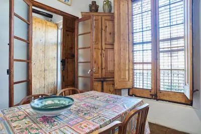 a dining room with a table with a bowl on it at Torre d'en Malla in Martorell
