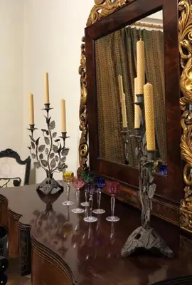 a dining room table with a mirror and candles at Torre d'en Malla in Martorell