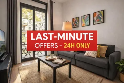 a living room with a couch and a table at Stylish Apartment with Balcony in Central Barcelona in Barcelona