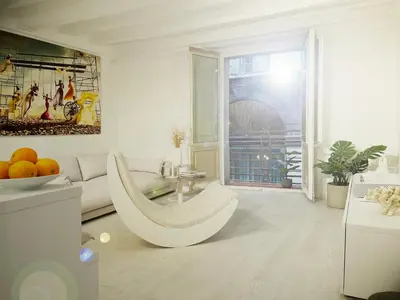 a white living room with a couch and a table at Key White in Barcelona
