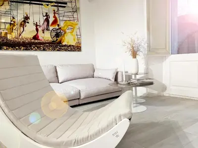 a living room with a couch and a table at Key White in Barcelona