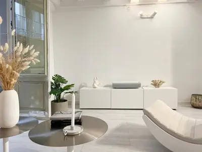 a white living room with a table and a couch at Key White in Barcelona