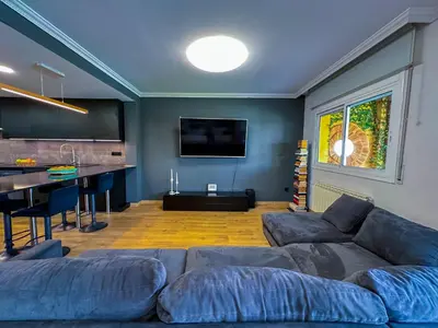 a porch with a couch and a table on a balcony at Villa Rocamar by Hello Homes Sitges in Sitges