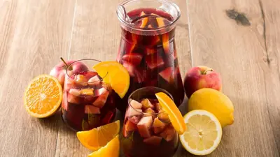 a table with a jar of sangria and some fruit at Design Apartment in Barcelona in Barcelona