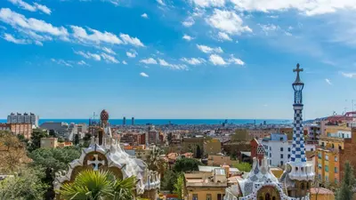 a view of a city with a cross in the sky at Design Apartment in Barcelona in Barcelona
