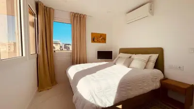 a bedroom with a large bed and a window at Ático premium Rambla Catalunya - Terraza 50 m2 in Barcelona