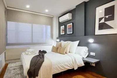 a bedroom with a bed and a window at Cozy Apartment III - Les Corts in Barcelona