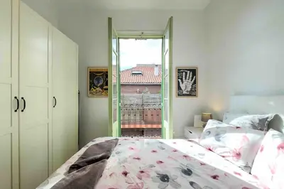 a bedroom with a bed and a large window at Central apartment in Barcelona in Barcelona
