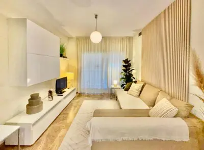 a living room with a couch and a tv at Entire Apartment in Barcelona, Camp Nou, Les Corts in Barcelona