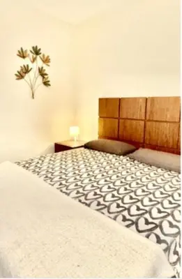 a bedroom with a large bed with a white blanket at Entire Apartment in Barcelona, Camp Nou, Les Corts in Barcelona