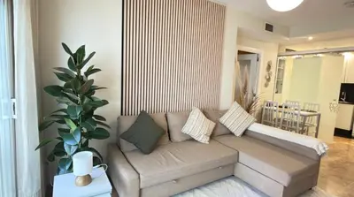 a living room with a couch and a table at Entire Apartment in Barcelona, Camp Nou, Les Corts in Barcelona