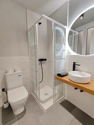 a bathroom with a shower and a toilet and a sink at Lovely apartment Poblenou beach in Barcelona