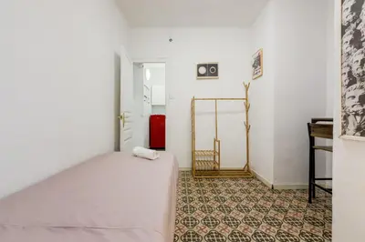 a balcony with a white bench on a building at Apartamento de 3 habitaciones en Barcelona in Hospitalet de Llobregat