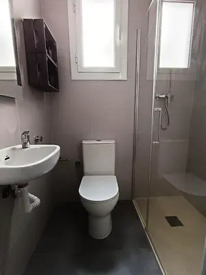 a bathroom with a toilet and a sink and a shower at Barcelona Eixample - Sagrada Familia - Monumental - City Center in Barcelona