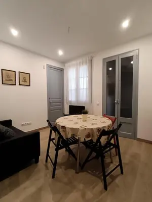 a dining room with a table and two chairs at Barcelona Eixample - Sagrada Familia - Monumental - City Center in Barcelona