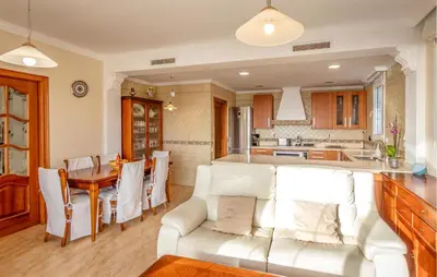 a living room with a white couch and a table at Gorgeous Home In Arenys De Munt in Arenys de Munt