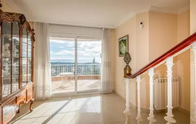 a staircase in a home with a large window at Gorgeous Home In Arenys De Munt in Arenys de Munt