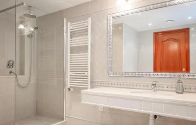 a bathroom with a sink and a shower and a mirror at Gorgeous Home In Arenys De Munt in Arenys de Munt