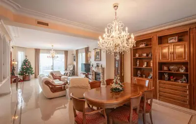 a living room with a dining room table and a chandelier at Gorgeous Home In Arenys De Munt in Arenys de Munt