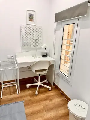 a kitchen with a washing machine and a white refrigerator at Habitación 3 Metro Sant Antoni in Barcelona