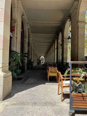 a hallway with benches and tables in a building at Born penthouse loft 1 in Barcelona