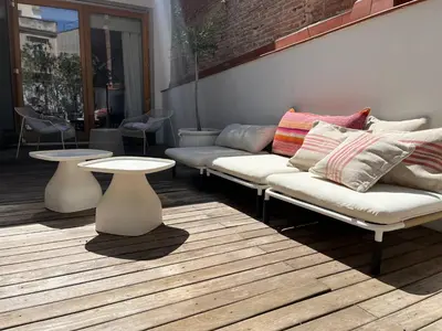 a living room with two couches and two tables at Born penthouse loft 1 in Barcelona