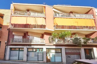 an apartment building with balconies and plants on it at BBarcelona Guinardó Park in Barcelona
