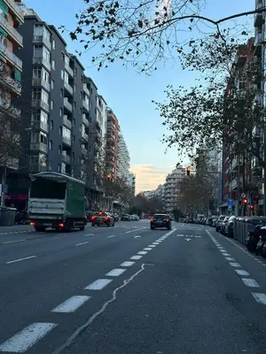 a busy city street with cars and a truck at Mirian in Barcelona