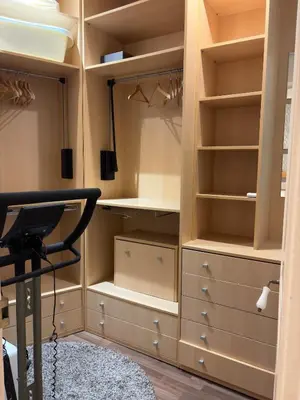 a room with a closet with drawers and shelves at Cozy Apartment in the Center Area Sagrada Familia in Barcelona