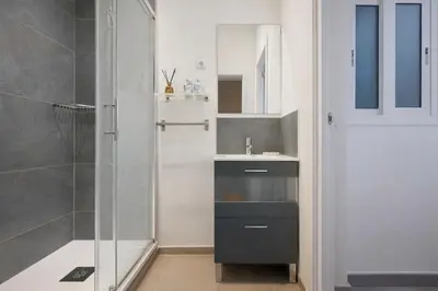 a bathroom with a shower and a sink at Boutique Murillo in Barcelona