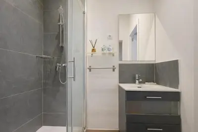 a bathroom with a shower and a sink and a mirror at Boutique Murillo in Barcelona