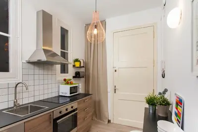 a kitchen with a sink and a microwave at Catalan Music Palace with private terrace in Barcelona