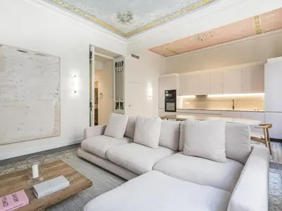 a living room with a couch and a table at The Residences At Bartomeu 26 Suite Bartomeu in Sitges