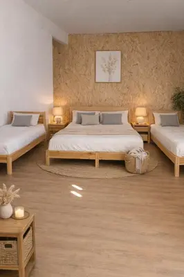 a bedroom with two beds and two tables at Villa Agaporni in Senmanat